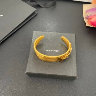 YSL Wide Monogram Engraved Gold Cuff Bracelet