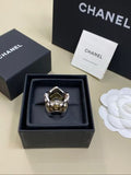 CHANEL Gold and Silver Two-Tone Wave Ring
