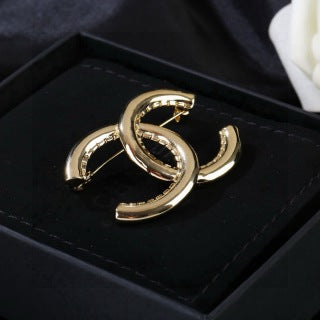 CHANEL Golden Interlock CC Sculptural Brooch