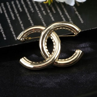 CHANEL Golden Interlock CC Sculptural Brooch