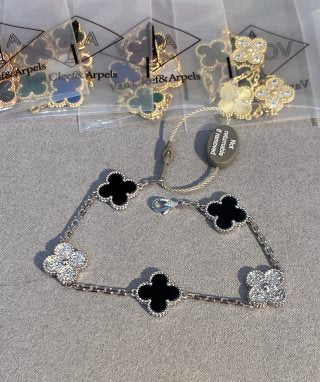 Van Cleef & Arpels 5-Motif Clover Bracelet with White Mother-of-Pearl, Black Onyx, and Gold-Tone Accents