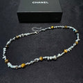 Chunky necklace featuring tiger's eye, silver beads, and crushed silver elements.