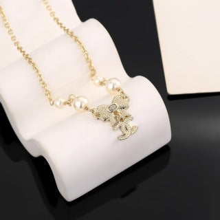 Chanel Pearl Bow Charm Necklace