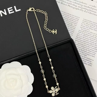 Chanel Elegant Pearl Bow Charm Necklace