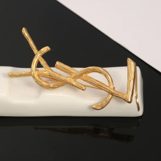 YSL Sculpted Gold Monogram Brooch